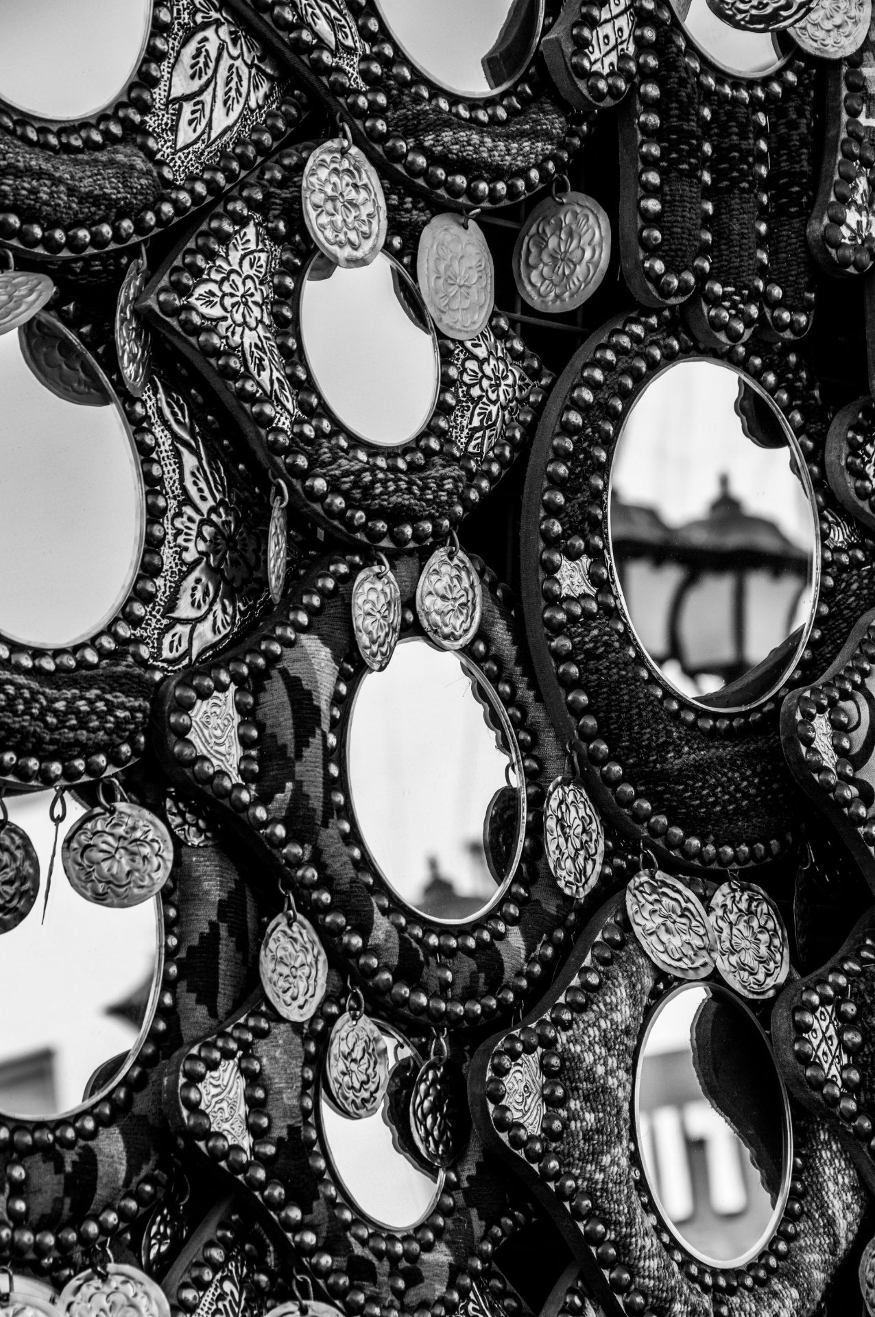 Ornate mirrors reflecting different angles of the same room
